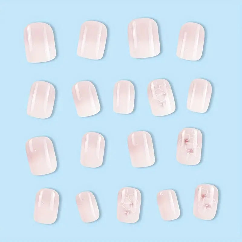 Faux Ongles Dégradé Rose Nude avec Fleurs 3D Blanches – Élégance Naturelle pour Manucure Chic