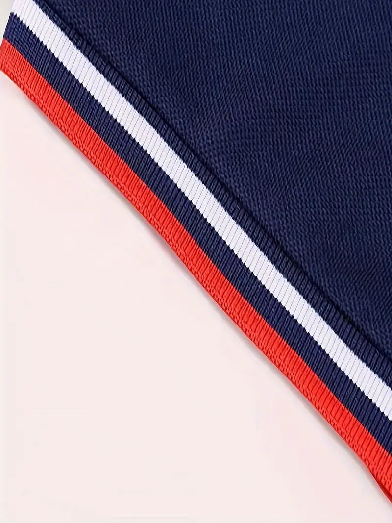 Chemise polo garçon bleu marine à col tricolore et motif dinosaure – tenue élégante et décontractée