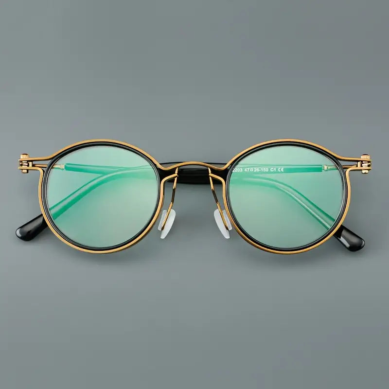 Lunettes homme rondes rétro – Monture dorée et noire élégante avec verres transparents