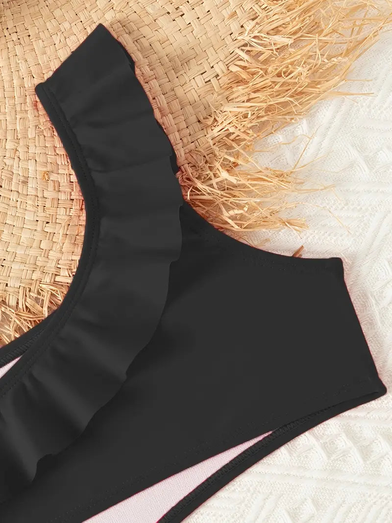 Maillot de bain fille noir une pièce asymétrique avec volant – Élégant et tendance pour l’été