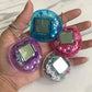 Tamagotchi Rétro Porte-Clés – Jeu Électronique Animaux Virtuels avec Boîtier Transparent Coloré