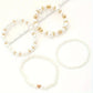Bracelets femme perles blanches et dorées – Lot de 5 bijoux élégants et tendance