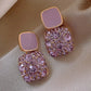 Boucles d’oreilles mariage femme – Pendants dorés avec cristaux scintillants et pierre rouge élégante