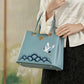 Sac à main femme bleu élégant  Design japonais avec grue brodée et finitions dorées
