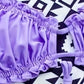 Bas de bikini violet froncé/noir à nouer – Coupe échancrée et tissu stretch pour sublimer les courbes