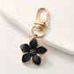 Porte-clés fleur en métal doré, coloris Fleur noir