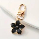 Porte-clés fleur en métal doré, coloris Fleur noir