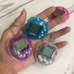 Tamagotchi Rétro Porte-Clés – Jeu Électronique Animaux Virtuels avec Boîtier Transparent Coloré