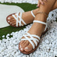 Sandales plates pour femme à lanières tissées simples et élégantes