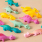 Dinosaures élastiques colorés – Jouets fantaisie extensibles pour farces et jeux amusants
